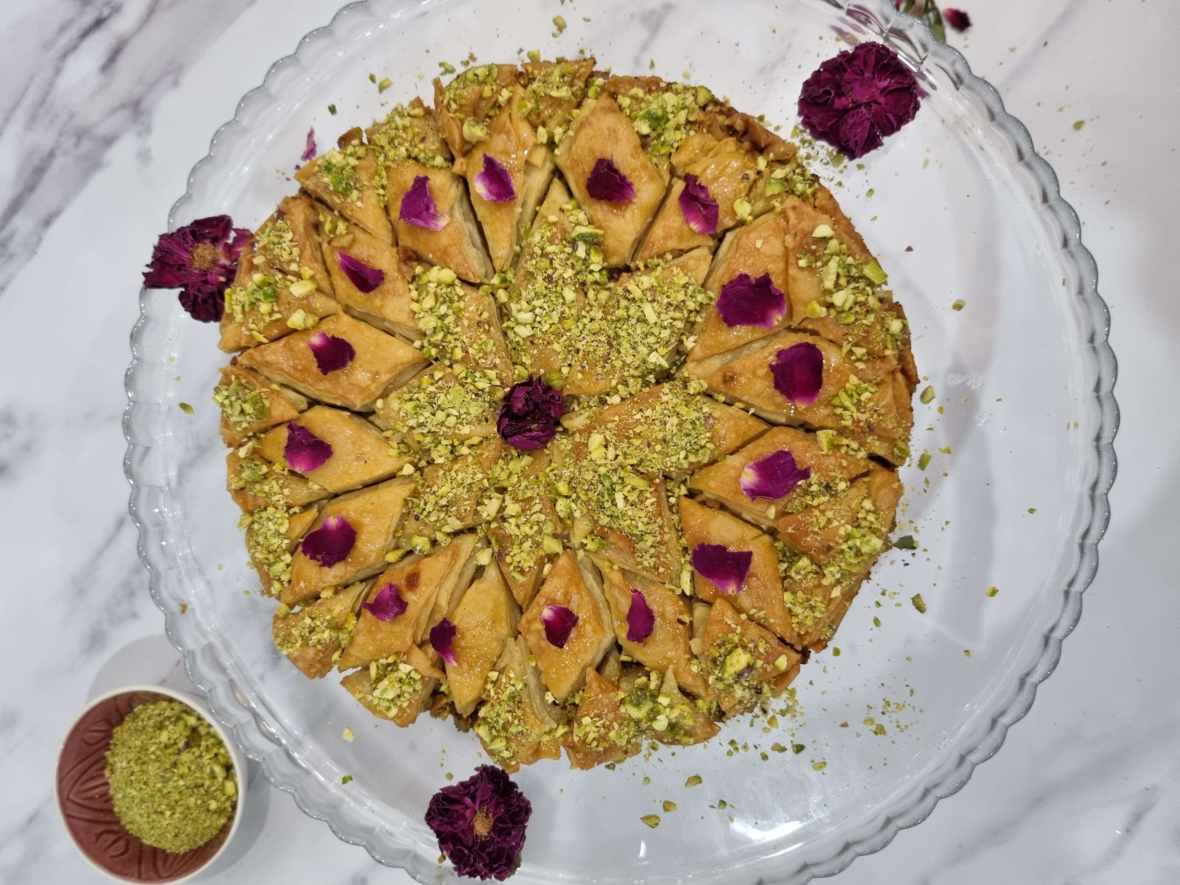 Homemade baklava with pistachios and rose petals
